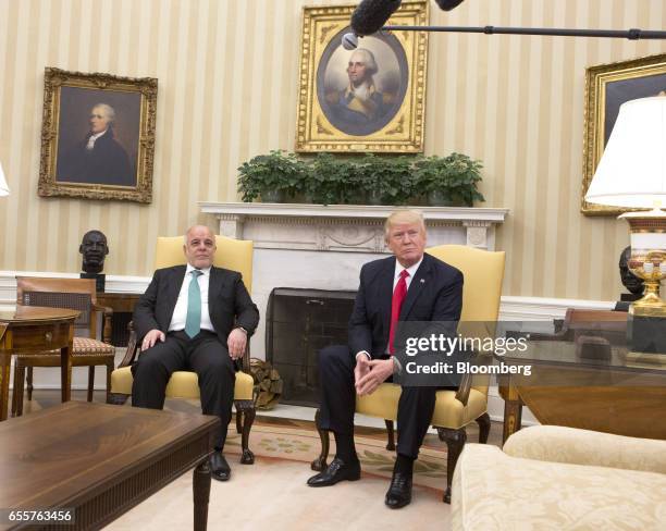 President Donald Trump, right, meets with Haider al-Abadi, Iraq's prime minister, at the White House in Washington, D.C., U.S., on Monday, March 20,...