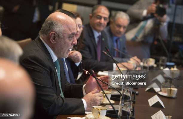 Haider al-Abadi, Iraq's prime minister, left, speaks during a meeting with U.S. President Donald Trump, not pictured, at the White House in...