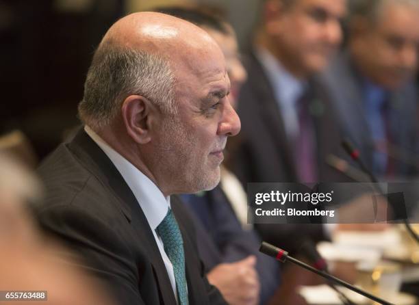 Haider al-Abadi, Iraq's prime minister, listens during a meeting with U.S. President Donald Trump, not pictured, at the White House in Washington,...