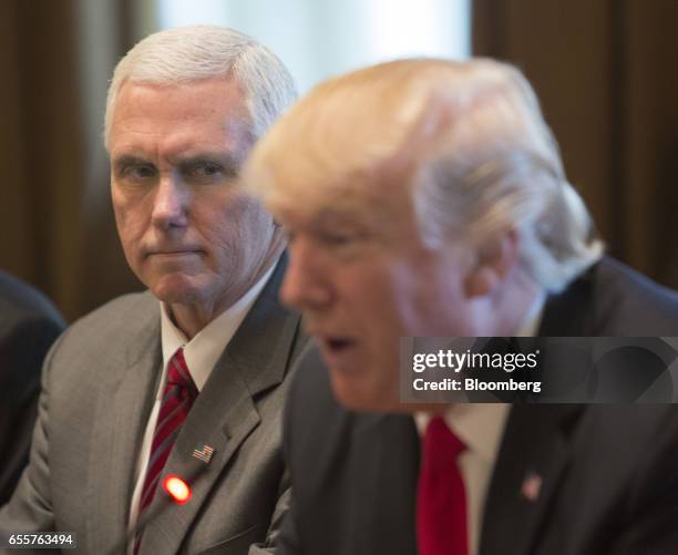 Vice President Mike Pence, left, listens as U.S. President Donald Trump, speaks during a meeting with Haider al-Abadi, Iraq's prime minister, not...