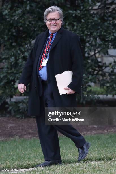 White House chief strategist, Steve Bannon to Marine One before departing the White House with U.S. President Donald Trump, on March 20, 2017 in...