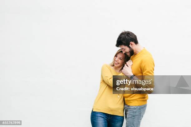 coppia carina - man hugging woman foto e immagini stock