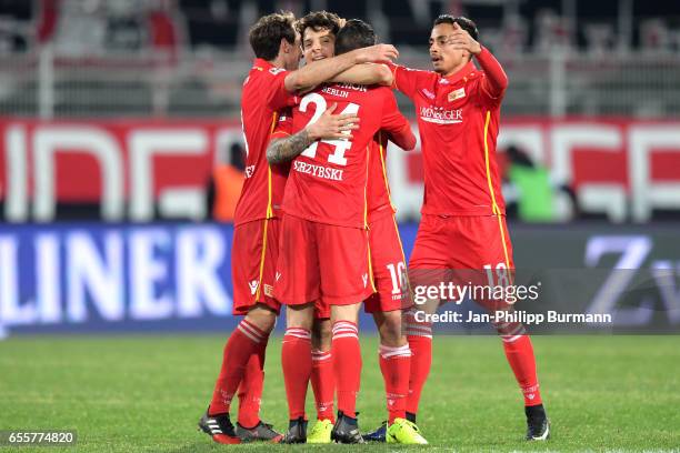 Stephan Fuerstner, Steven Skrzybski, Philipp Hosiner and Kenny Prince Redondo of 1 FC Union Berlin celebrate the 1:0 win after the game between 1 FC...