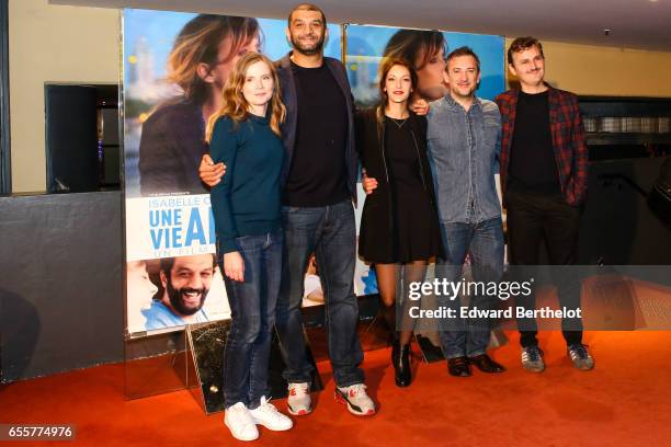 Isabelle Carre, Ramzy Bedia, Maria Duplaa, Olivier Peyon, and Olivier Ruidavet attend the "Une Vie Ailleurs" Paris Premiere at UGC Cine Cite des...