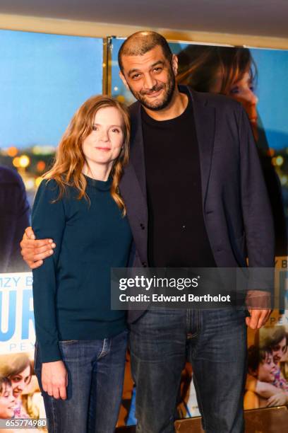 Isabelle Carre and Ramzy Bedia attend the "Une Vie Ailleurs" Paris Premiere at UGC Cine Cite des Halles on March 20, 2017 in Paris, France.