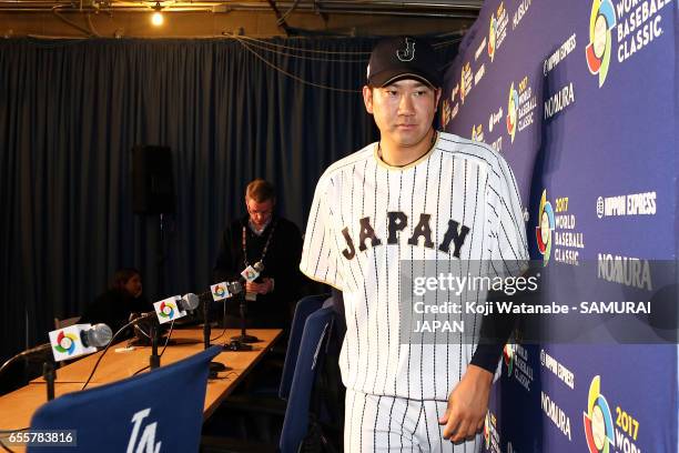 Tomoyuki Sugano of Japan attends a press conference during a training session ahead of the World Baseball Classic Championship Round at Dodger...