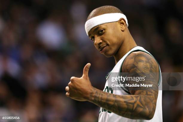 Isaiah Thomas of the Boston Celtics gives a thumbs up during the second quarter against the Washington Wizards at TD Garden on March 20, 2017 in...