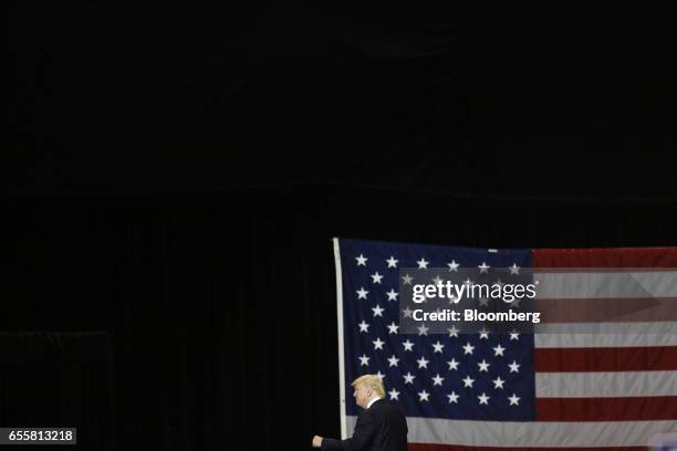 President Donald Trump gestures as he arrives for a rally at the Kentucky Exposition Center in Louisville, Kentucky, U.S., on Monday, March 20, 2017....