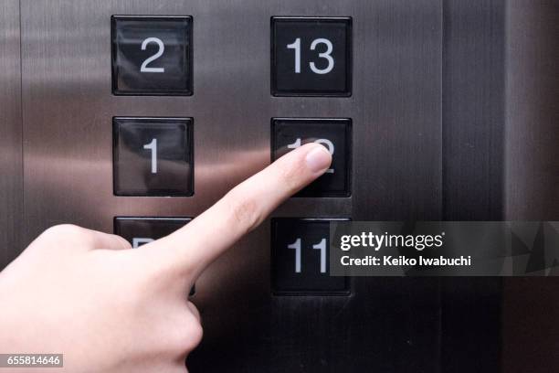 pushing elevator button - elevator button stock pictures, royalty-free photos & images