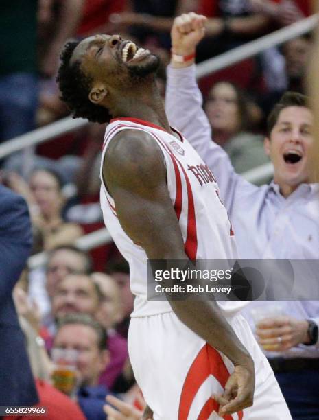 Patrick Beverley of the Houston Rockets reacts after making a three-point shot during the fourth quarter against the Denver Nuggets at Toyota Center...