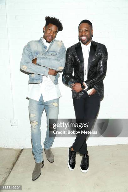 Chicago Bulls teammates Jimmy Butler and Dwyane Wade share a laugh while striking a pose backstage at Dwyane Wade's A Night on the Runwade Fashion...