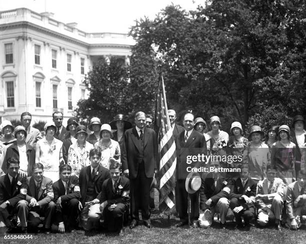 President Hoover received the regional winners in the flag contest, sponsored by the Hearst Publications at the White House today. Kneeling in front...