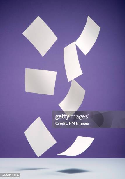 flying sheets of paper - falla bildbanksfoton och bilder