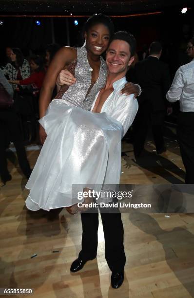 Olympian Simone Biles and dancer Sasha Farber attend "Dancing with the Stars" Season 24 premiere at CBS Televison City on March 20, 2017 in Los...