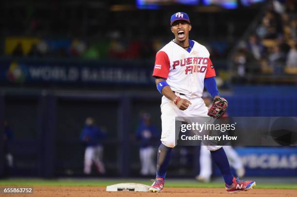 Francisco Lindor of the Puerto Rico celebrates an inning-ending double play against team Netherlands during Game 1 of the Championship Round of the...