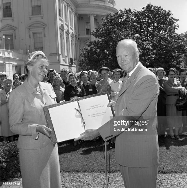 President Eisenhower made an earnest defense of his foreign aid programs in a 20-minutes, off-the-cuff talk to representatives of the League of Women...
