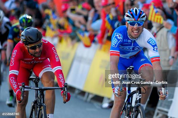 Davide Cimolai of FDJ cycling team and Nacer Bouhanni of Cofidis Solutions Credit cycling team sprint before the finish line, during the first stage...