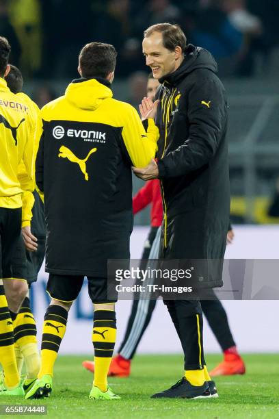 Christian Pulisic of Dortmund and Head coach Thomas Tuchel of Dortmund celebrate their winduring the Bundesliga match between Borussia Dortmund and...