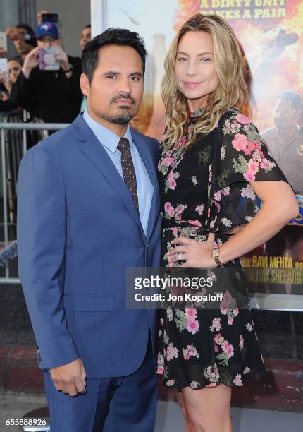 Michael Pena and Brie Shaffer arrive at the Los Angeles Premiere "CHiPS" at TCL Chinese Theatre on March 20, 2017 in Hollywood, California.