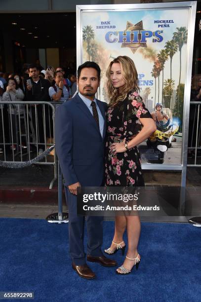 Actor Michael Pena and Brie Shaffer arrive at the premiere of Warner Bros. Pictures' "CHiPS" at the TCL Chinese Theatre on March 20, 2017 in...