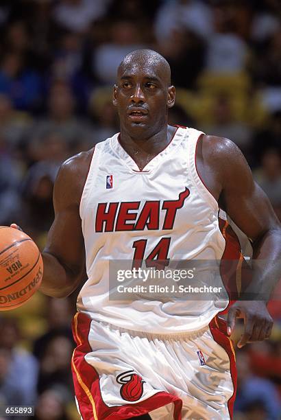 Anthony Mason of the Miami Heat dribbles the ball during the game against the New Jersey Nets at the American Airlines Arena in Miami, Florida. The...