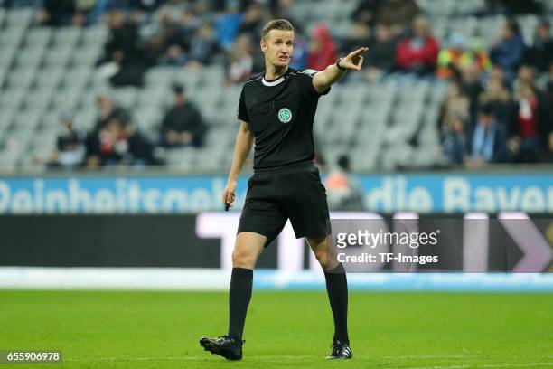 Referee Arne Aarnink gestures during the Second Bundesliga match between TSV 1860 Muenchen and FC Wuerzburger Kickers at Allianz Arena on March 17,...