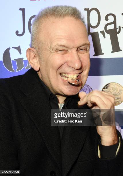 Jean Paul Gaultier poses with a coin he designed during "France By Jean Paul Gaultier": Limited Coin Collection Press Preview At La Monnaie de Paris...