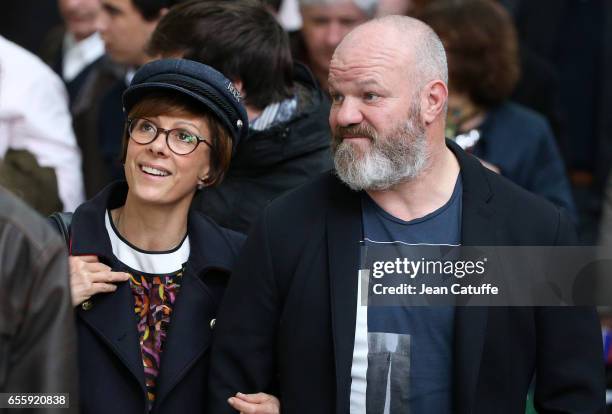 Philippe Etchebest and his wife Dominique Etchebest attend the Grand Prix Hermes CSI5 show jumping event on day three of the Saut Hermes at the Grand...
