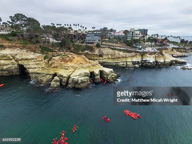 kayaking through the la jolla sea caves. - la jolla stock pictures, royalty-free photos & images