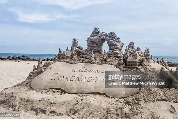 sand castles on coronado beach, san diego. - sand sculpture stockfoto's en -beelden