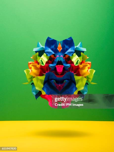 ball of multi colored papers in kaleidoscope pattern - origami stockfoto's en -beelden