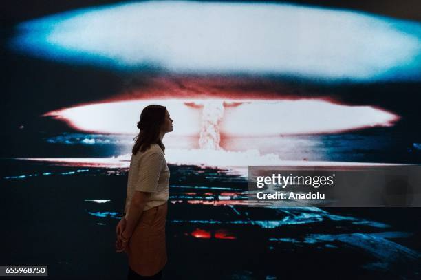 Imperial War Museum London staff views a photograph of a British nuclear weapons test over Christmas Island in the 1950s in London, England on March...