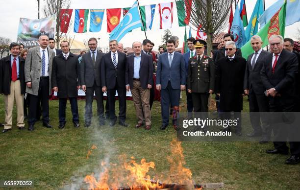 Governor of Istanbul Vasip Sahin and Mayor of Istanbul Kadir Topbas pose for a photo with participants during the Newroz celebrations at Topkapi...