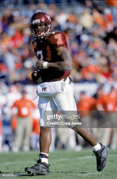 Quaterback Michael Vick the Virginia Tech Hokies jogs on the field during the Gator Bowl Game against the Clemson Tigers at the Gator Bowl in...