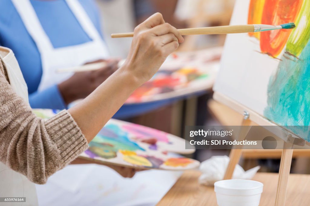 Close up of female artist's hand