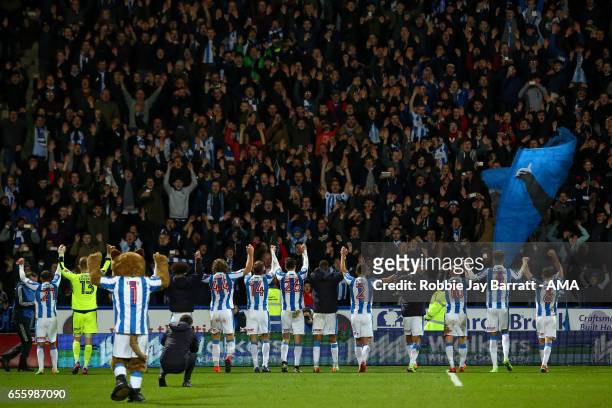 Huddersfield Town players celebrate with their fans at full time during the Sky Bet Championship match between Huddersfield Town and Aston Villa at...