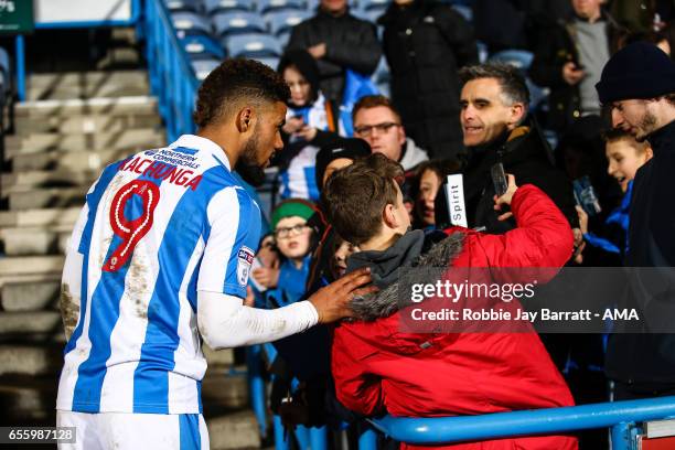 Elias Kachunga of Huddersfield Town has a photo with a fan during the Sky Bet Championship match between Huddersfield Town and Aston Villa at John...