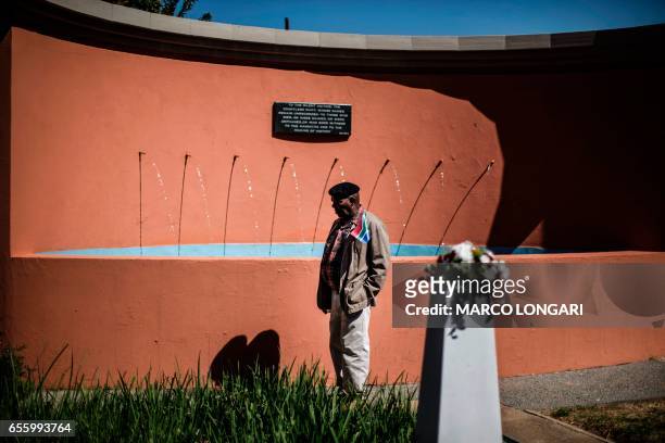 Man pauses at the monument commemorating the victims of the 1960 Sharpeville massacre, in Sharpville on March 21, 2017. On March 21, 1960 after a day...