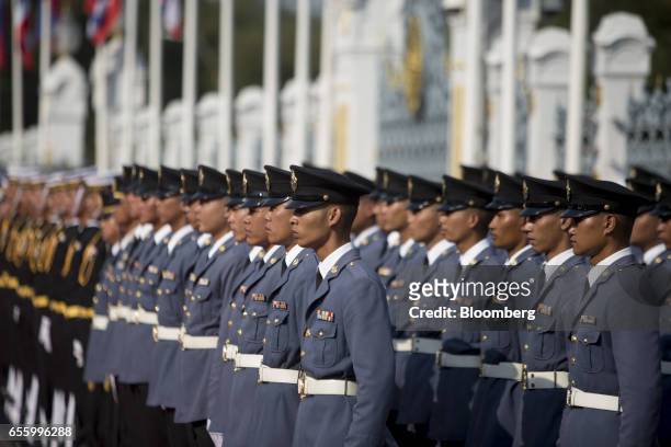 Members of the Royal Thai Air Force stand to attention ahead of a news conference at Government House in Bangkok, Thailand, on Tuesday, March 21,...