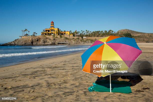 todos santos, umbrella on the beach. - todos santos bildbanksfoton och bilder