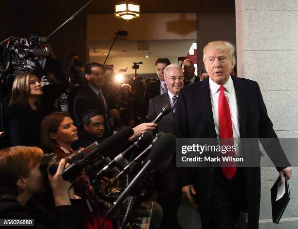 President Donald Trump and HHS Secretary Tom Price walk to a House Republican closed party conference on Capitol Hill, on March 21, 2017 in...