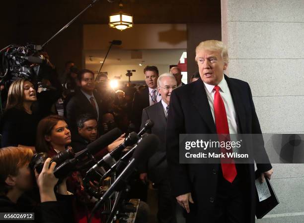 President Donald Trump and HHS Secretary Tom Price walk to a House Republican closed party conference on Capitol Hill, on March 21, 2017 in...