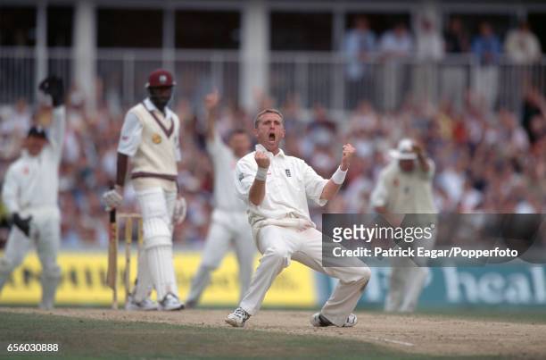 England bowler Dominic Cork celebrates the wicket of West Indies batsman Wavell Hinds, LBW for 2, in the 5th Test match between England and West...