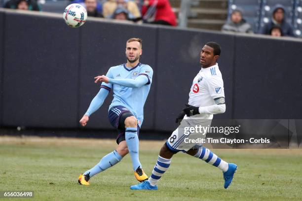 March 18: Maxime Chanot of New York City FC clears while challenged by Patrice Bernier of Montreal Impact during the New York City FC Vs Montreal...