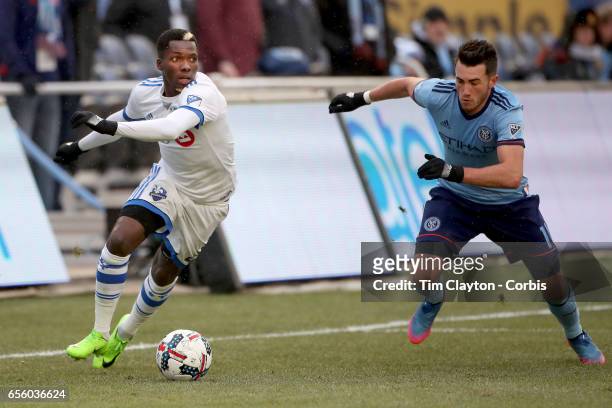 March 18: Jack Harrison of New York City FC challenges Ambroise Oyongo of Montreal Impact during the New York City FC Vs Montreal Impact regular...