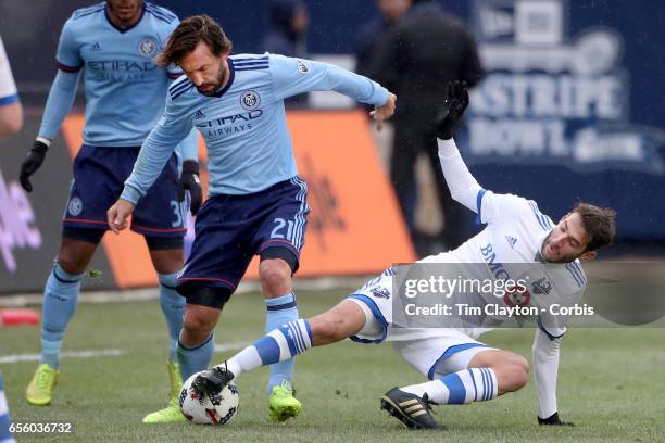 March 18: Andrea Pirlo of New York City FC is challenged by Ignacio Piatti of Montreal Impact during the New York City FC Vs Montreal Impact regular...