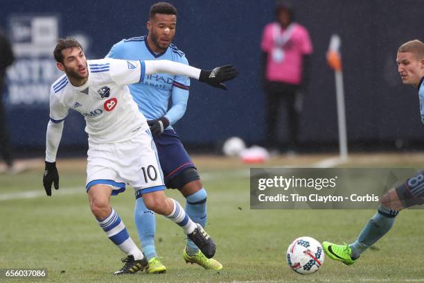 March 18: Ignacio Piatti of Montreal Impact is challenged by Ethan White of New York City FC during the New York City FC Vs Montreal Impact regular...