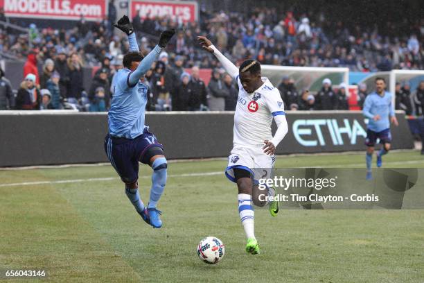 March 18: Jonathan Lewis of New York City FC and Ambroise Oyongo of Montreal Impact challenge for the ball during the New York City FC Vs Montreal...