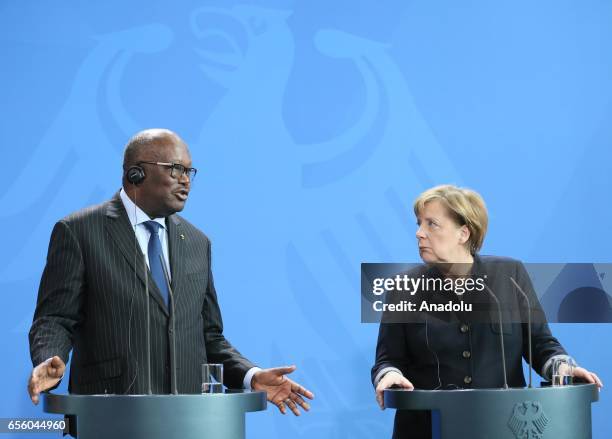 President of Burkina Faso, Roch Marc Christian Kabore delivers a speech during a joint press conference with German Chancellor Angela Merkel after...