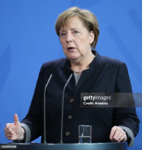 German Chancellor Angela Merkel delivers a speech during a joint press conference with the President of Burkina Faso, Roch Marc Christian Kabore...